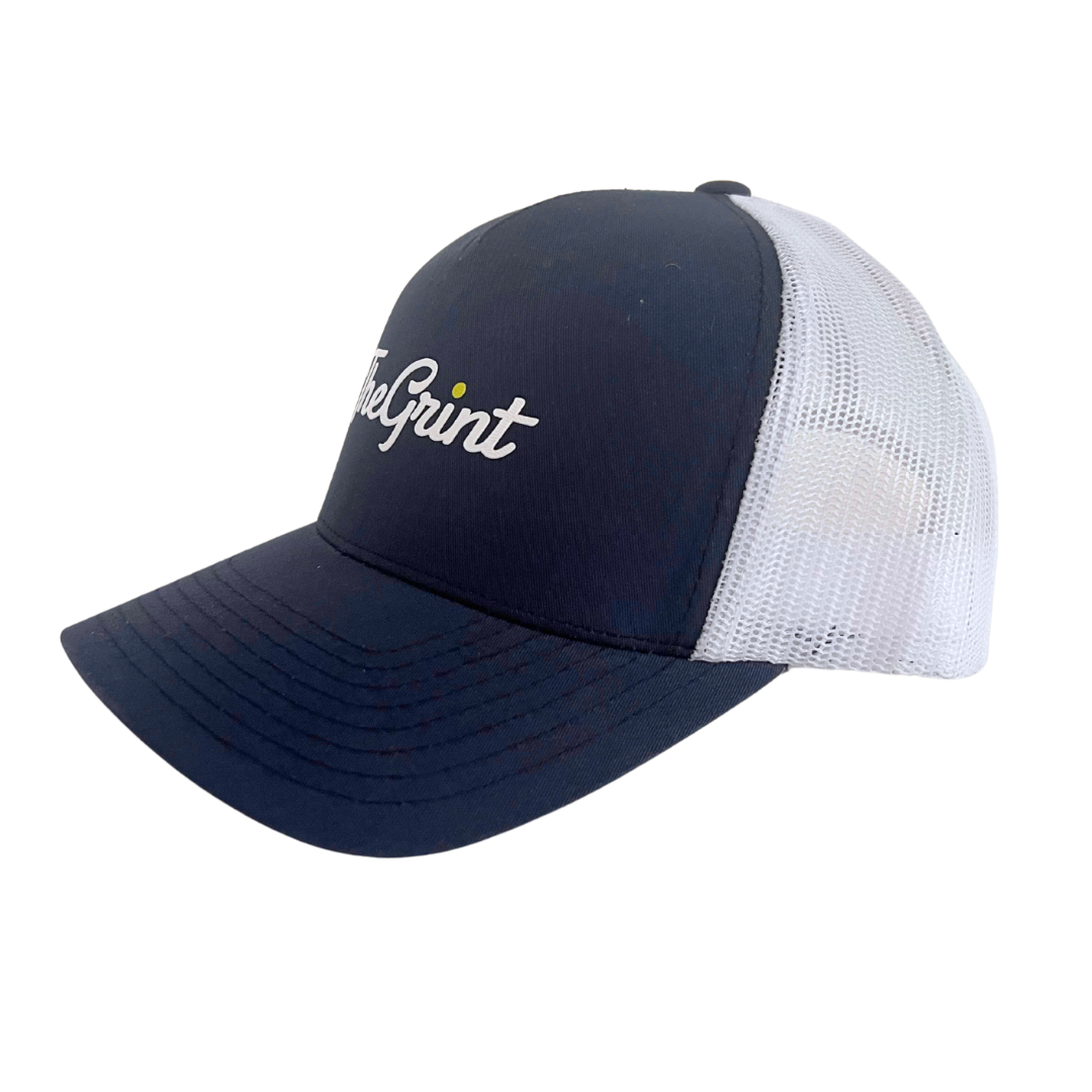 Navy and white TheGrint script logo trucker snapback