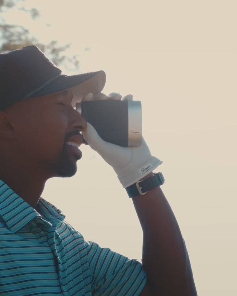 Golfer ranging the flag with a Swingman Autograph